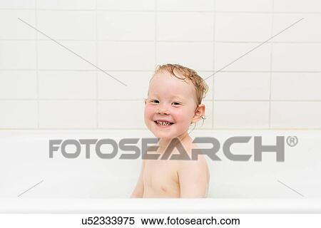 Portrait of young girl sitting in bathtub View Large Photo Image Stock Photography - Portrait of young girl sitting in bathtub. Fotosearch