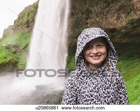 Portrait of young girl, waterfall behind, Seljalandsfoss, Iceland View Large Photo Image Stock Image - Portrait of young girl, waterfall behind, Seljalandsfoss, Iceland. Fotosearch