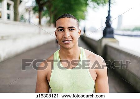 Portrait of young male runner on riverside View Large Photo Image Stock Image - Portrait of young male runner on riverside. Fotosearch