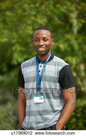 Stock Image - Portrait of young man, outdoors. Fotosearch