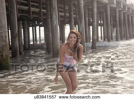 Portrait of young woman having fun in sea, Santa Monica, California, USA View Large Photo Image Stock Photo - Portrait of young woman having fun in sea, Santa Monica, California, USA. Fotosearch