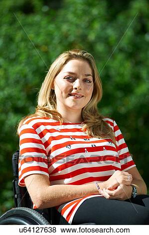 Stock Photo - Portrait of young woman, outdoors. Fotosearch