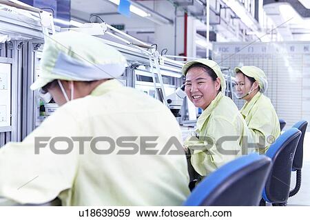 Quality check station at factory producing flexible electronic circuit boards. Plant is located in the south of China, in Zhuhai, Guangdong province View Large Photo Image Stock Photo - Quality check station at factory producing flexible electronic circuit boards. Plant is located in the south of China, in Zhuhai, Guangdong province. Fotosearch