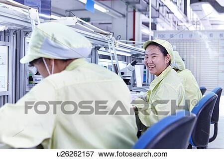 Stock Photo - Quality check station at factory producing flexible electronic circuit boards. Plant is located in the south of China, in Zhuhai, Guangdong province. Fotosearch