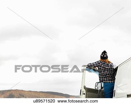Rear view of young woman looking out from camper van, Point Addis, Anglesea, Victoria, Australia View Large Photo Image Stock Image - Rear view of young woman looking out from camper van, Point Addis, Anglesea, Victoria, Australia. Fotosearch