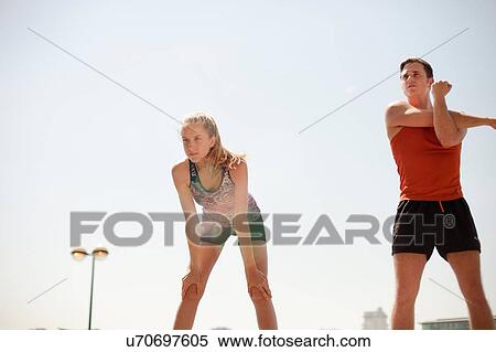 Runners stretching during exercise View Large Photo Image Stock Photography - Runners stretching during exercise. Fotosearch