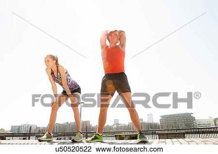 Runners stretching on riverfront, Wapping, London View Large Photo Image Stock Image - Runners stretching on riverfront, Wapping, London. Fotosearch