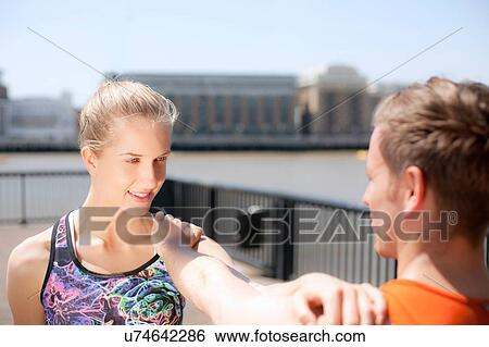 Runners stretching on riverfront, Wapping, London View Large Photo Image Stock Photograph - Runners stretching on riverfront, Wapping, London. Fotosearch