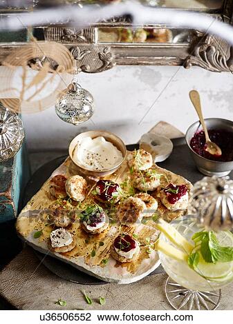Sage and mustard chicken patties with micro herbs and cranberry relish View Large Photo Image Stock Image - Sage and mustard chicken patties with micro herbs and cranberry relish. Fotosearch