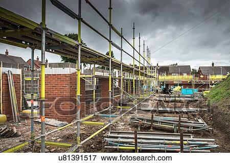 Scaffolding on building of construction site View Large Photo Image Stock Photo - Scaffolding on building of construction site. Fotosearch