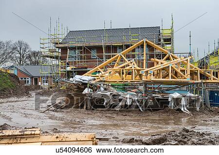 Scaffolding on building of construction site View Large Photo Image Stock Photograph - Scaffolding on building of construction site. Fotosearch