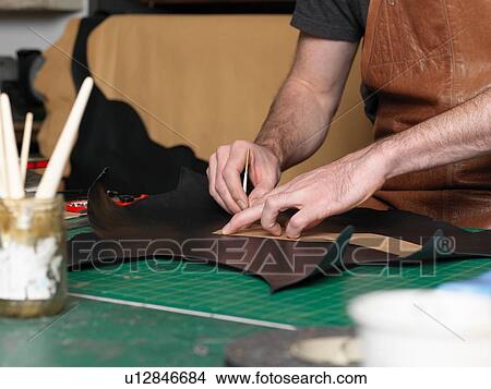Shoemaker working in workshop View Large Photo Image Picture - Shoemaker working in workshop. Fotosearch