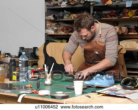 Shoemaker working in workshop View Large Photo Image Stock Image - Shoemaker working in workshop. Fotosearch
