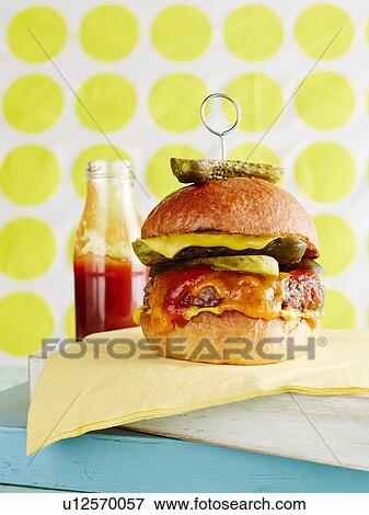 Still life of cheeseburger with retro background View Large Photo Image Stock Photo - Still life of cheeseburger with retro background. Fotosearch