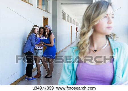 Student looking out window, friends gossiping in background View Large Photo Image Stock Photo - Student looking out window, friends gossiping in background. Fotosearch