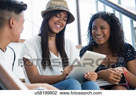 Students on steps, using digital tablet View Large Photo Image Stock Image - Students on steps, using digital tablet. Fotosearch