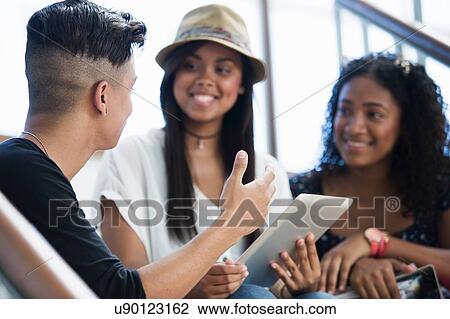 Students on steps, using digital tablet View Large Photo Image Stock Image - Students on steps, using digital tablet. Fotosearch