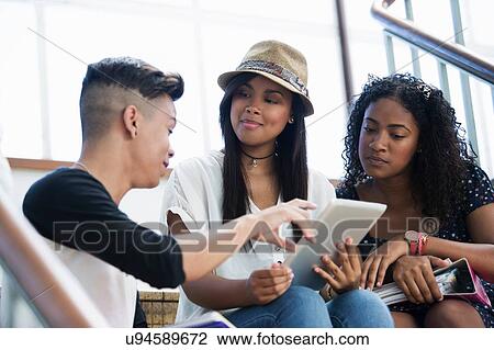 Students on steps, using digital tablet View Large Photo Image Stock Image - Students on steps, using digital tablet. Fotosearch
