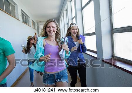 Students running down hallway, laughing View Large Photo Image Stock Image - Students running down hallway, laughing. Fotosearch