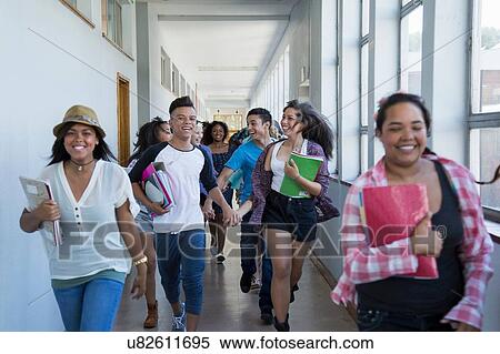 Students running down hallway, laughing View Large Photo Image Stock Photography - Students running down hallway, laughing. Fotosearch