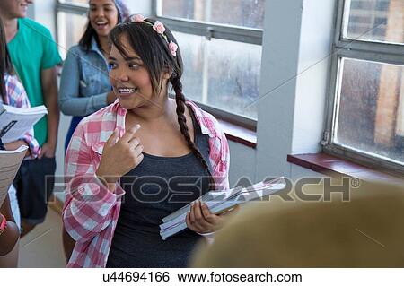 Students walking down hallway, chatting View Large Photo Image Stock Photograph - Students walking down hallway, chatting. Fotosearch