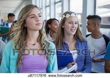 Students walking down hallway, chatting View Large Photo Image Stock Photograph - Students walking down hallway, chatting. Fotosearch