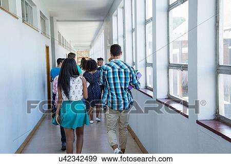 Stock Photo - Students walking down hallway. Fotosearch