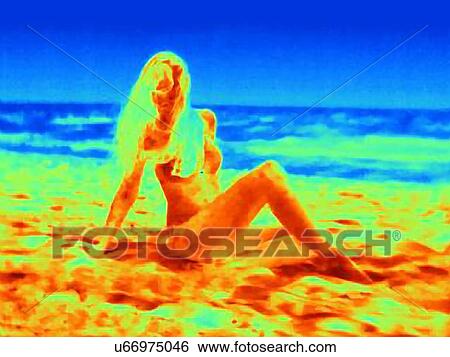 Thermal image of mid adult woman sitting on beach View Large Photo Image Stock Photograph - Thermal image of mid adult woman sitting on beach. Fotosearch