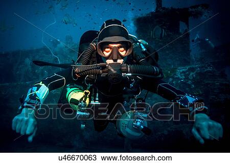 Underwater portrait of technical diver using a rebreather device to locate shipwreck, Lombok, Indonesia View Large Photo Image Stock Image - Underwater portrait of technical diver using a rebreather device to locate shipwreck, Lombok, Indonesia. Fotosearch