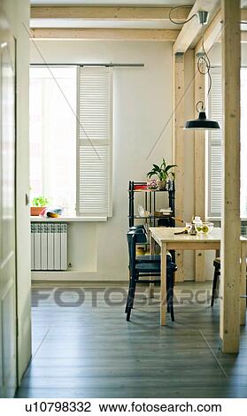 View of dining area with table and chair View Large Photo Image Stock Image - View of dining area with table and chair. Fotosearch