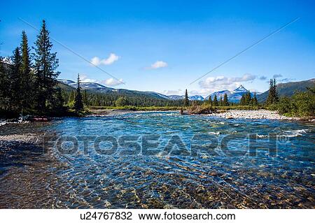 Stock Image - View of river and distant mountains, Ural mountains, Russia. Fotosearch