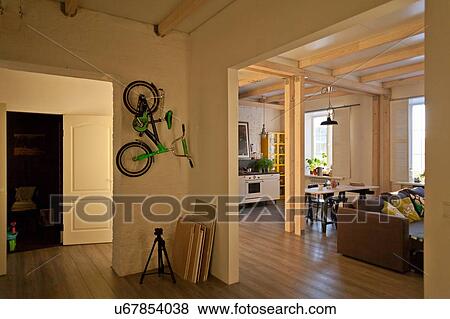 View of storage room, kitchen, dining area, couch and bicycle on wall View Large Photo Image Stock Photo - View of storage room, kitchen, dining area, couch and bicycle on wall. Fotosearch