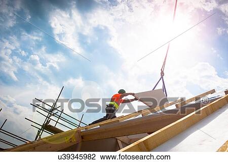 Stock Image - Worker on construction site. Fotosearch