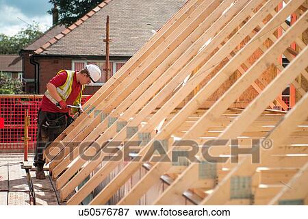 Stock Photo - Worker on construction site. Fotosearch