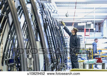 Workers cleaning parts in automotive parts spray paint factory View Large Photo Image Stock Image - Workers cleaning parts in automotive parts spray paint factory. Fotosearch