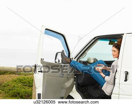 Young woman eating breakfast cereal in camper van, Point Addis, Anglesea, Victoria, Australia View Large Photo Image Stock Photography - Young woman eating breakfast cereal in camper van, Point Addis, Anglesea, Victoria, Australia. Fotosearch