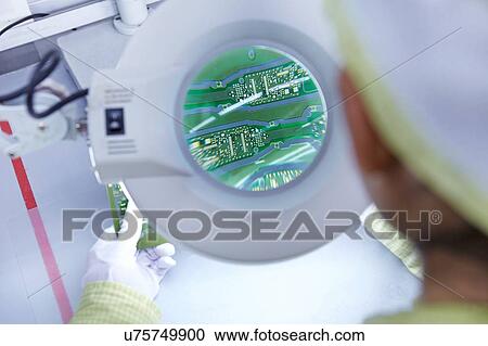 Young woman using magnifier at quality check station at factory producing flexible electronic circuit boards. Plant is located in the south of China, in Zhuhai, Guangdong province View Large Photo Image Stock Image - Young woman using magnifier at quality check station at factory producing flexible electronic circuit boards. Plant is located in the south of China, in Zhuhai, Guangdong province. Fotosearch
