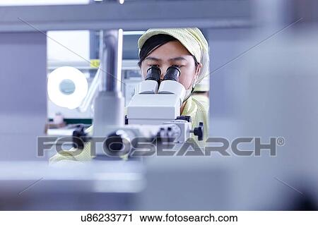 Young woman using microscope at quality check station at factory producing flexible electronic circuit boards. Plant is located in the south of China, in Zhuhai, Guangdong province View Large Photo Image Stock Image - Young woman using microscope at quality check station at factory producing flexible electronic circuit boards. Plant is located in the south of China, in Zhuhai, Guangdong province. Fotosearch