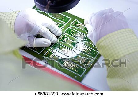 Young woman working at factory producing flexible electronic circuit boards. Plant is located in the south of China, in Zhuhai, Guangdong province View Large Photo Image Stock Image - Young woman working at factory producing flexible electronic circuit boards. Plant is located in the south of China, in Zhuhai, Guangdong province. Fotosearch