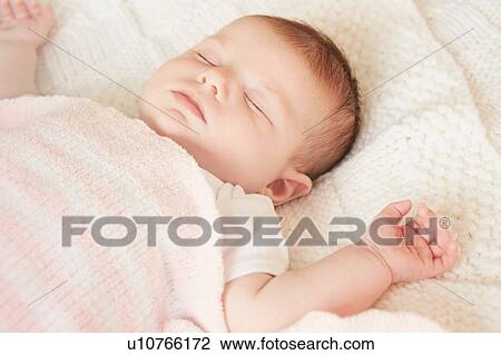 Baby sleeping in bed View Large Photo Image Stock Image - Baby sleeping in bed. Fotosearch