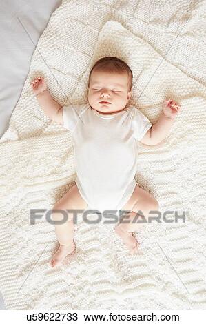 Baby sleeping in bed View Large Photo Image Stock Image - Baby sleeping in bed. Fotosearch