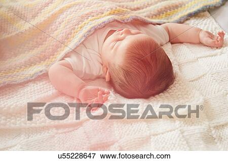 Baby sleeping in bed View Large Photo Image Stock Photo - Baby sleeping in bed. Fotosearch