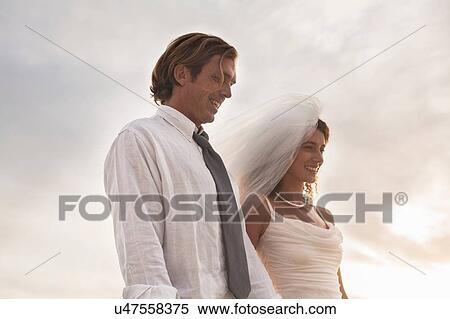 Stock Photography - Bride and groom, outdoors. Fotosearch