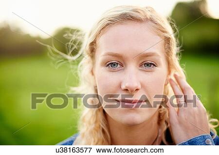 Close up portrait of young woman with blond hair View Large Photo Image Stock Photo - Close up portrait of young woman with blond hair. Fotosearch