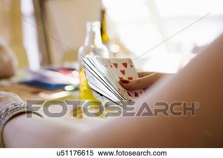 Cropped shot of woman playing card game View Large Photo Image Stock Photography - Cropped shot of woman playing card game. Fotosearch