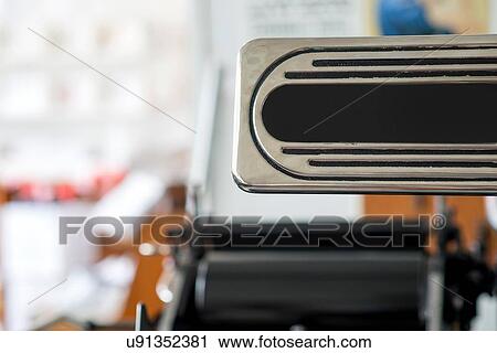 Stock Image - Detail of traditional letterpress print machine in workshop. Fotosearch