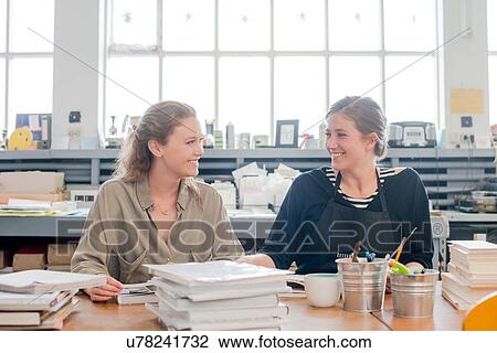 Female print designers talking in workshop View Large Photo Image Stock Image - Female print designers talking in workshop. Fotosearch