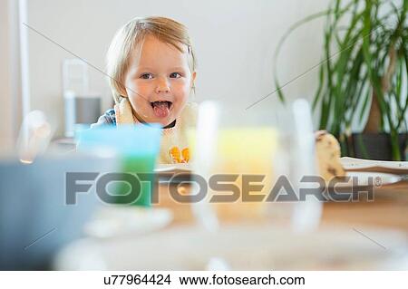 Female toddler at tea table View Large Photo Image Picture - Female toddler at tea table. Fotosearch