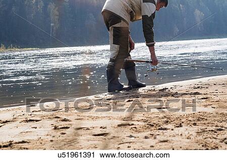 Fisherman at water's edge, Ural, Russia View Large Photo Image Stock Image - Fisherman at water's edge, Ural, Russia. Fotosearch