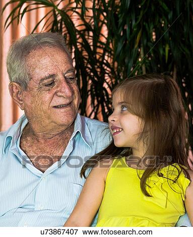 Girl chatting with grandfather View Large Photo Image Stock Photo - Girl chatting with grandfather. Fotosearch